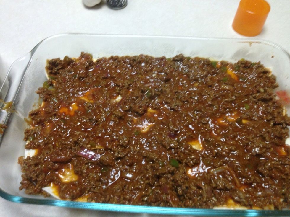 Put down 6-8 half circles of tortilla. Top with meat mixture.