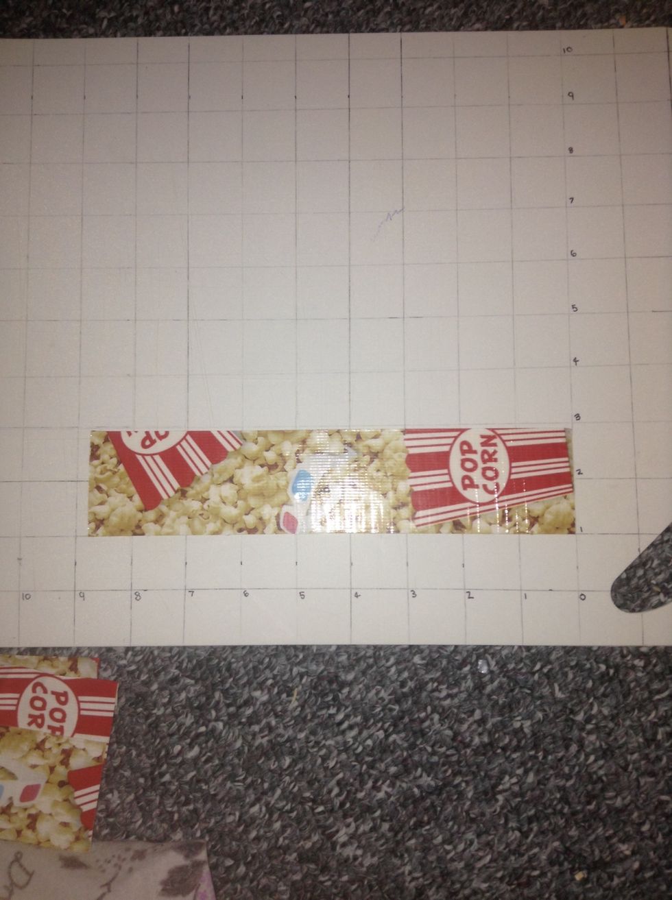 Put down a 9 inch piece of the pattern tape on the board.