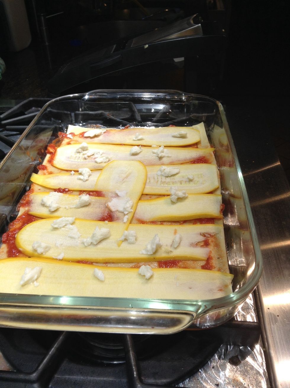 Put down a layer of zucchini green or yellow dot with ricotta add another layer of zucchini.