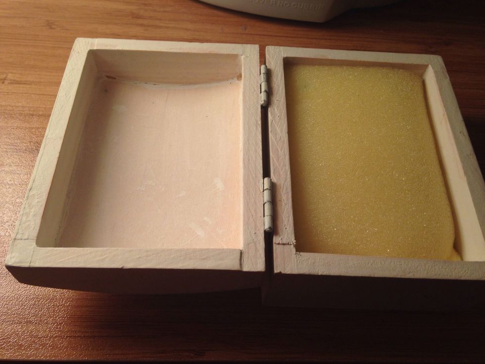 Put each half in the box. I put the small green half in the top and the larger yellow half inside.