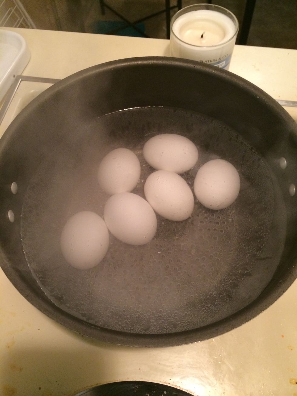 Put eggs in water & boil! I add a little salt to the water! (Sorry I didn't check the time but it usually takes around 8 minutes!) **Make sure the water covers the eggs!