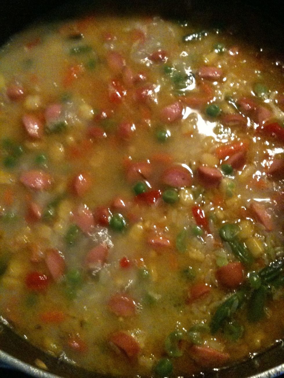 Put enuf water to just about reach the top of the rice, reduce heat to medium and cover pot. Leave it to cook until dryif not soft enuf add little water at a time until it reaches the texture you want