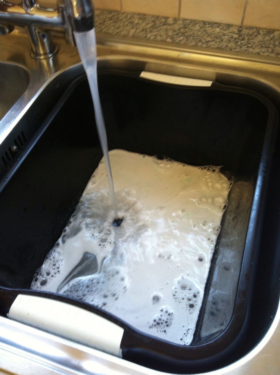 Put everyone into a washing basin then fill with hot water