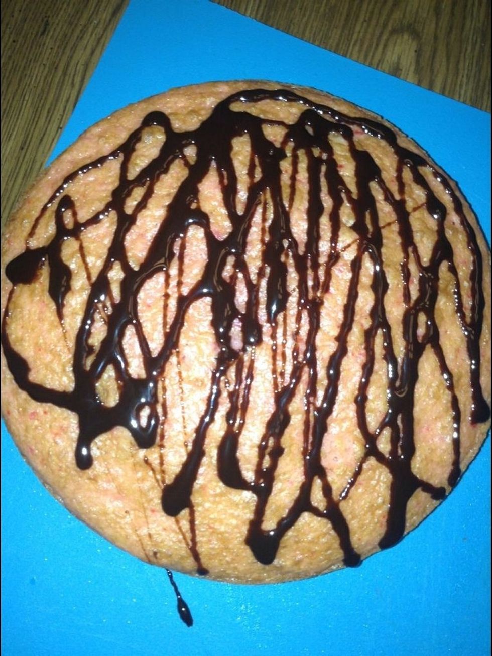 Put first later on a working surface put Hershey's syrup all over the top of the cake.