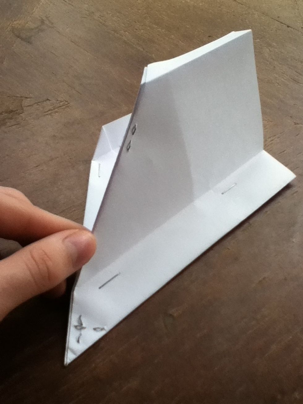 Put four staples in the body, and one in the front of each wing. These help to hold it together as well as weight it a little.