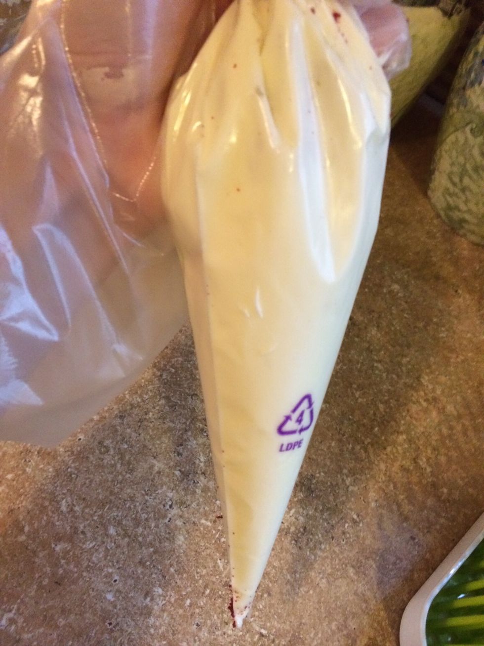 Put frosting into frosting bag to make spreading easier