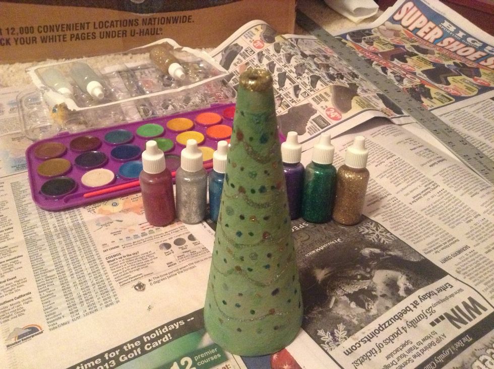 Put glitter on the top, and also a little of the sides to make it visible from a mantle, shelf, etc. Let dry completely, then put it on display!