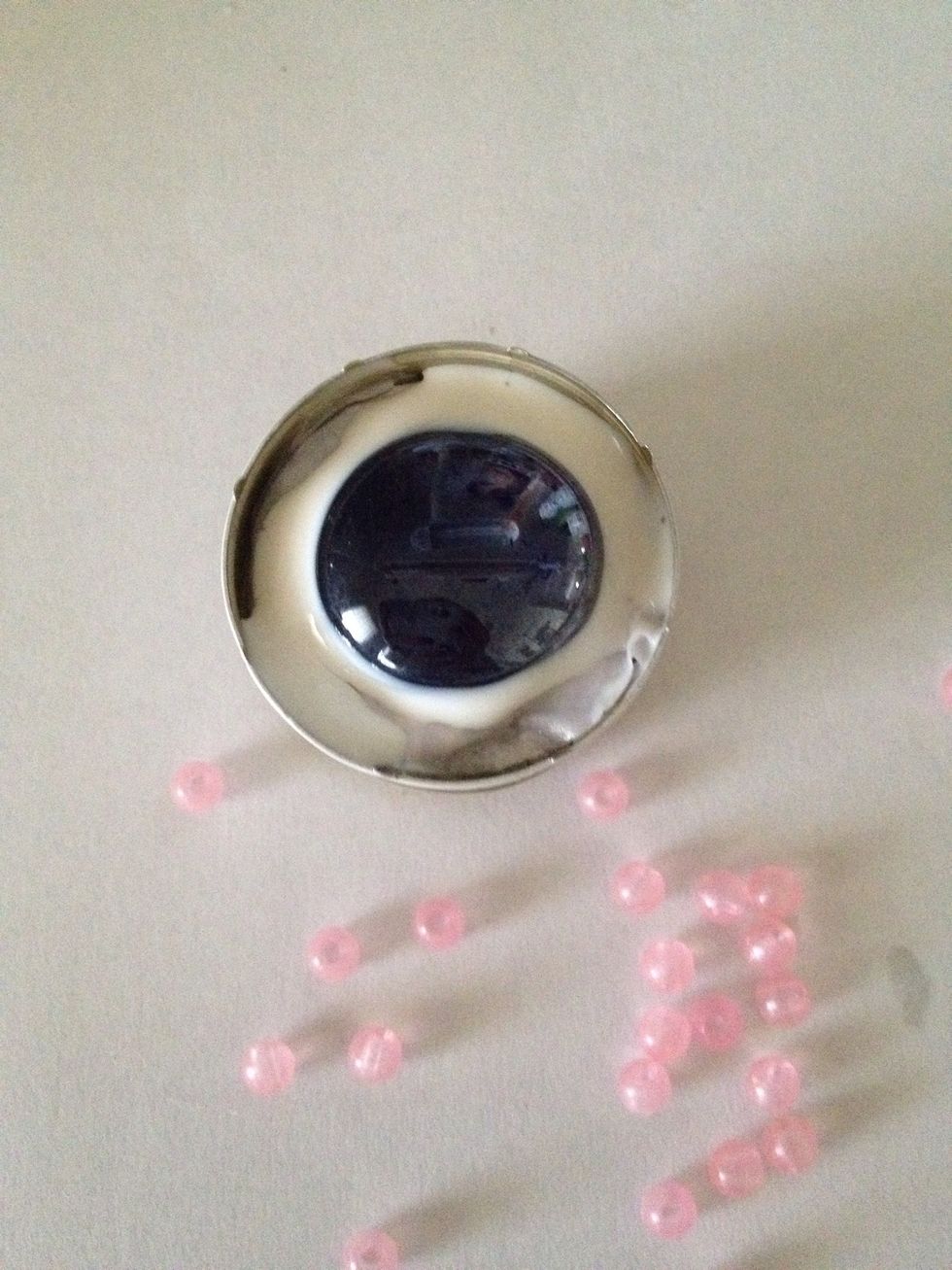 Put glue around the edges of your gem.