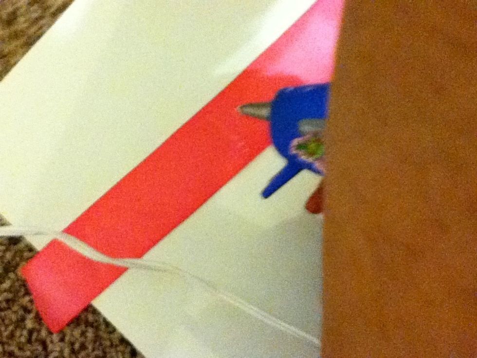 Put glue down the middle of the ribbon sorry for the bad photo its hard to glue and take a picture