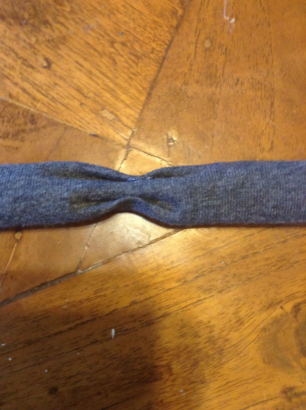 Put glue in the folds of the bow