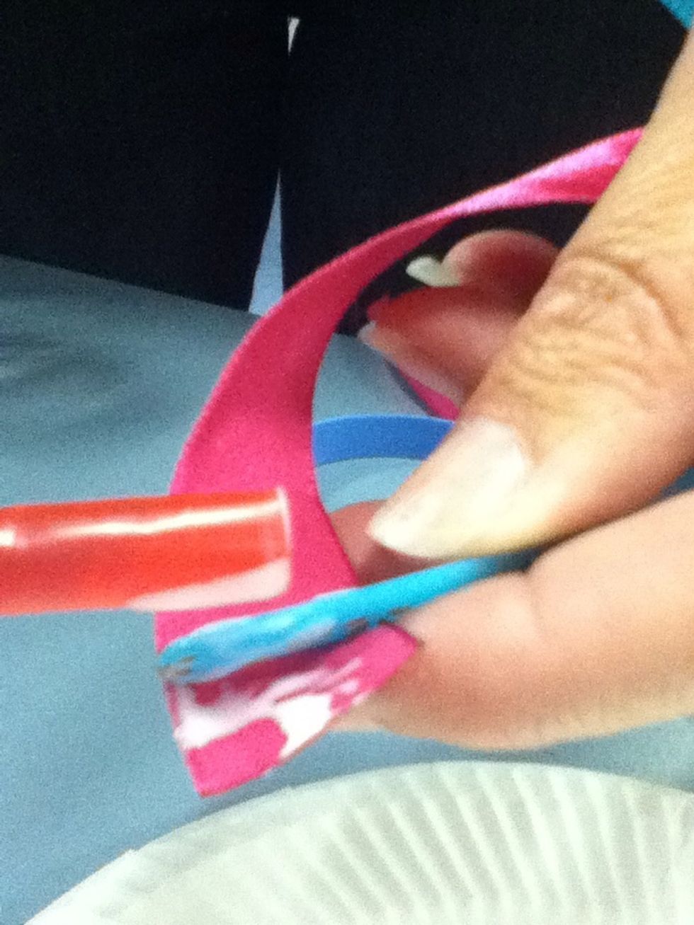 Put glue on end of ribbon before wrapping around plastic headband