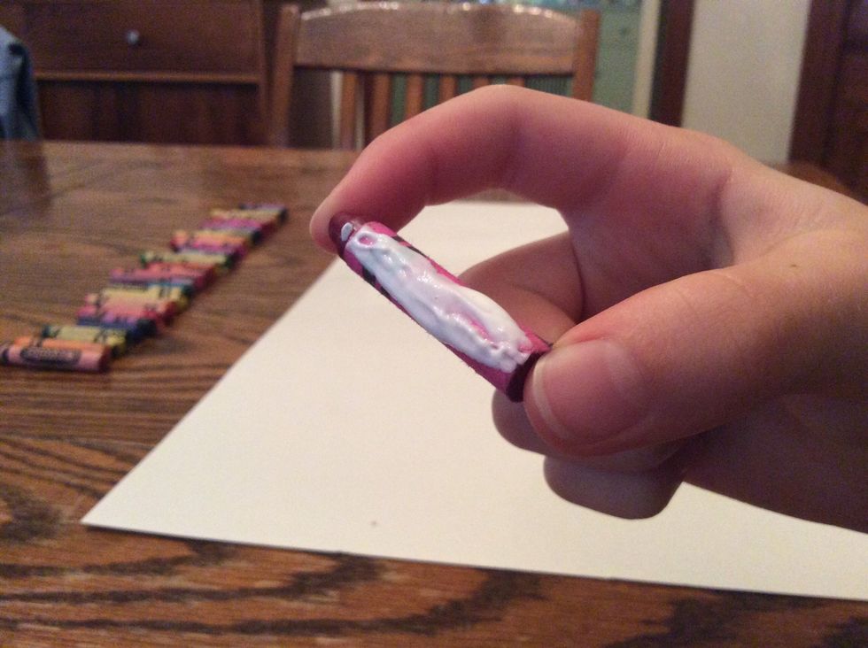 Put glue on one crayon. DO NOT USE HOT GLUE!!! If you do, it will melt when we melt the crayons.