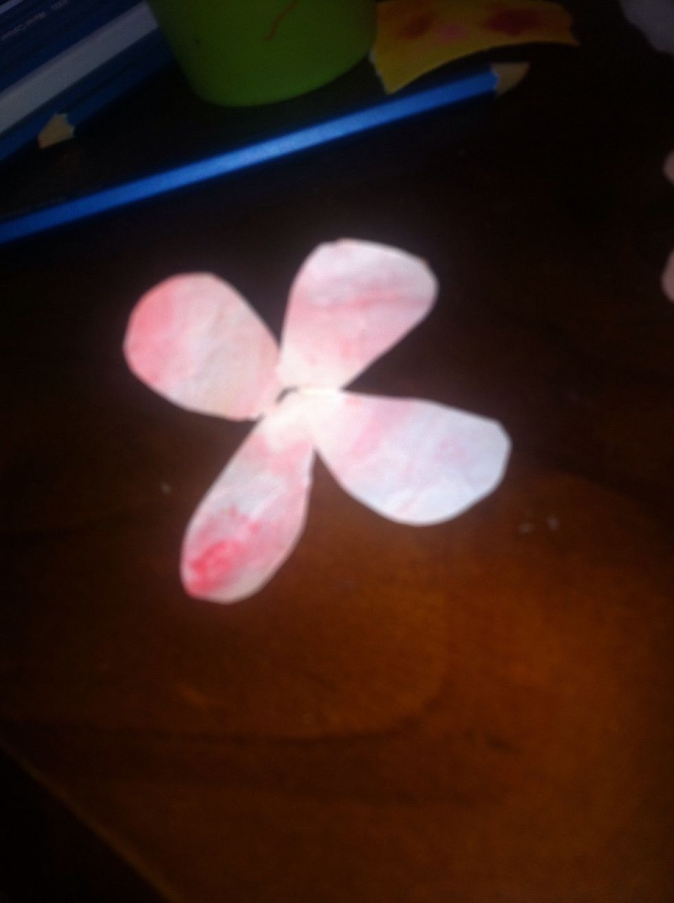 Put glue on the one with five petals and stict the petals together