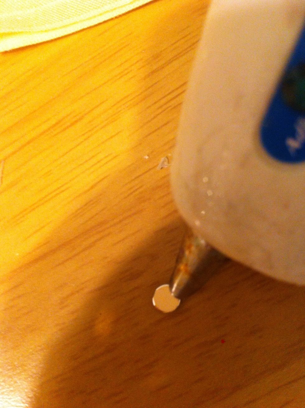 Put glue onto small jewel
