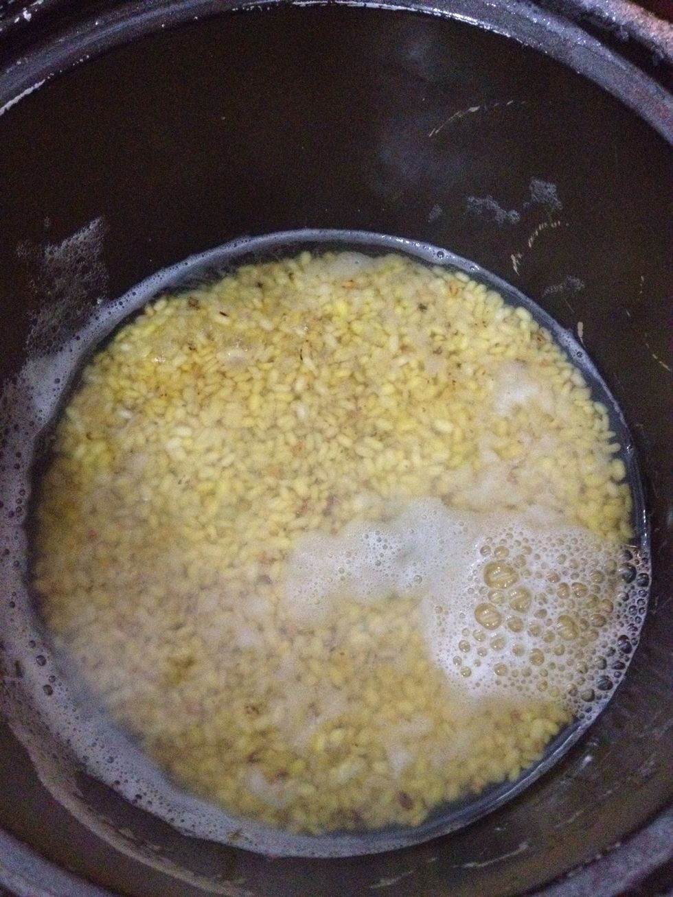 Put green beans to a rice cooker and cook it just like rice