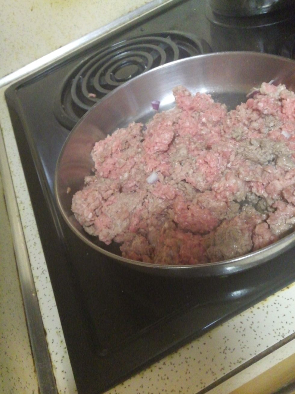 put ground beef in skillet to fry