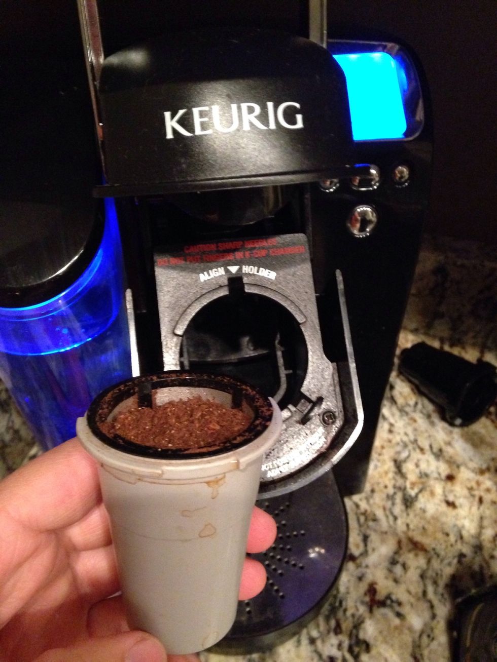 Put ground coffee beans into coffee maker