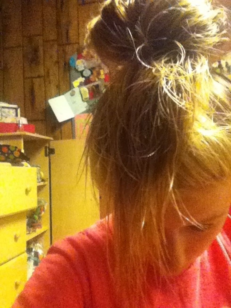 Put hair in bun with extra hair in front!(: