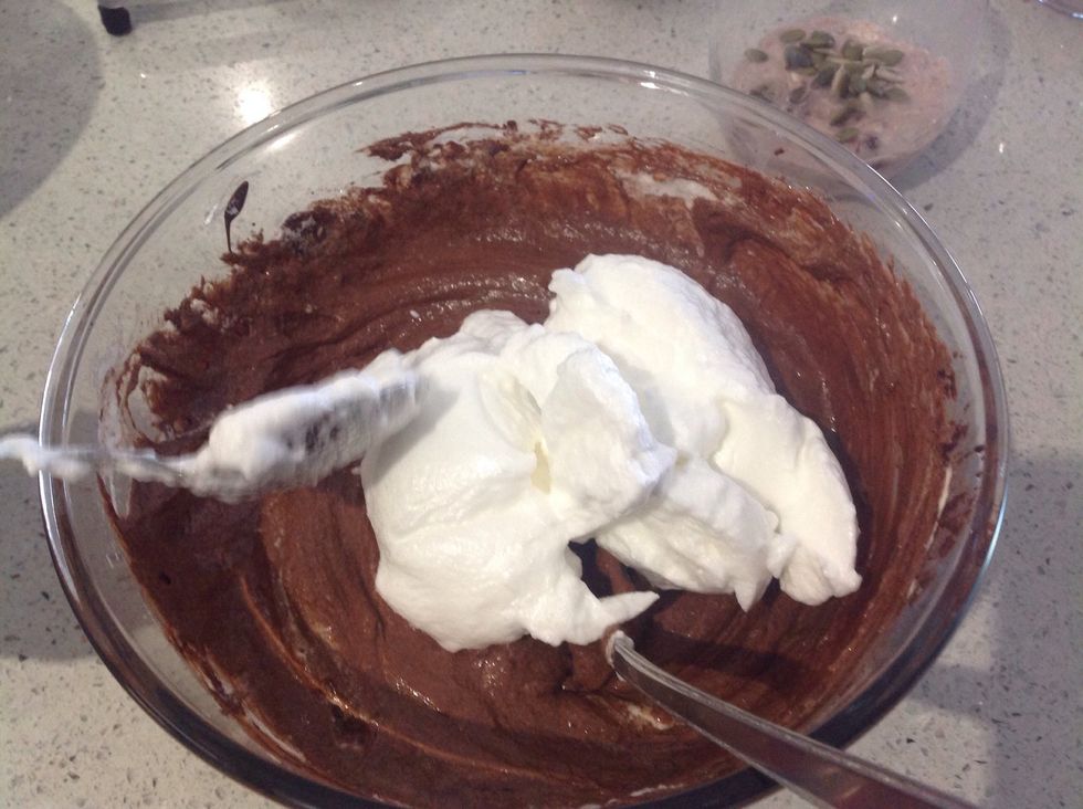 Put half of the egg whites into the dark chocolate mixture and fold lightly until well combined.