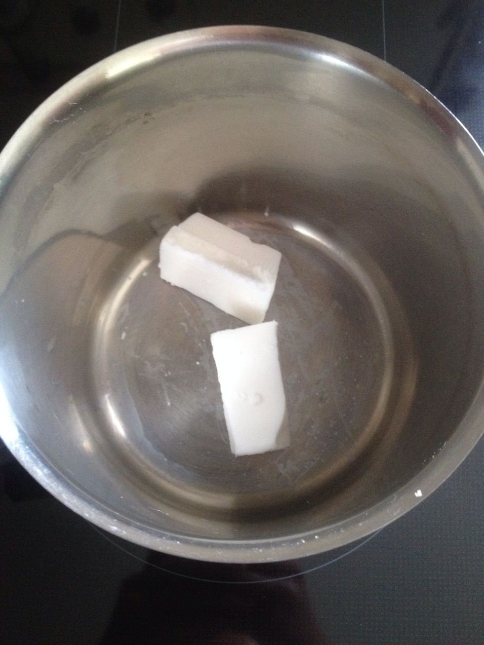 Put hard coconut oil in a pot and melt it.