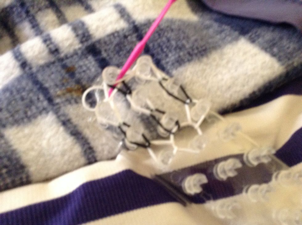 Put hook through and put a band on the end