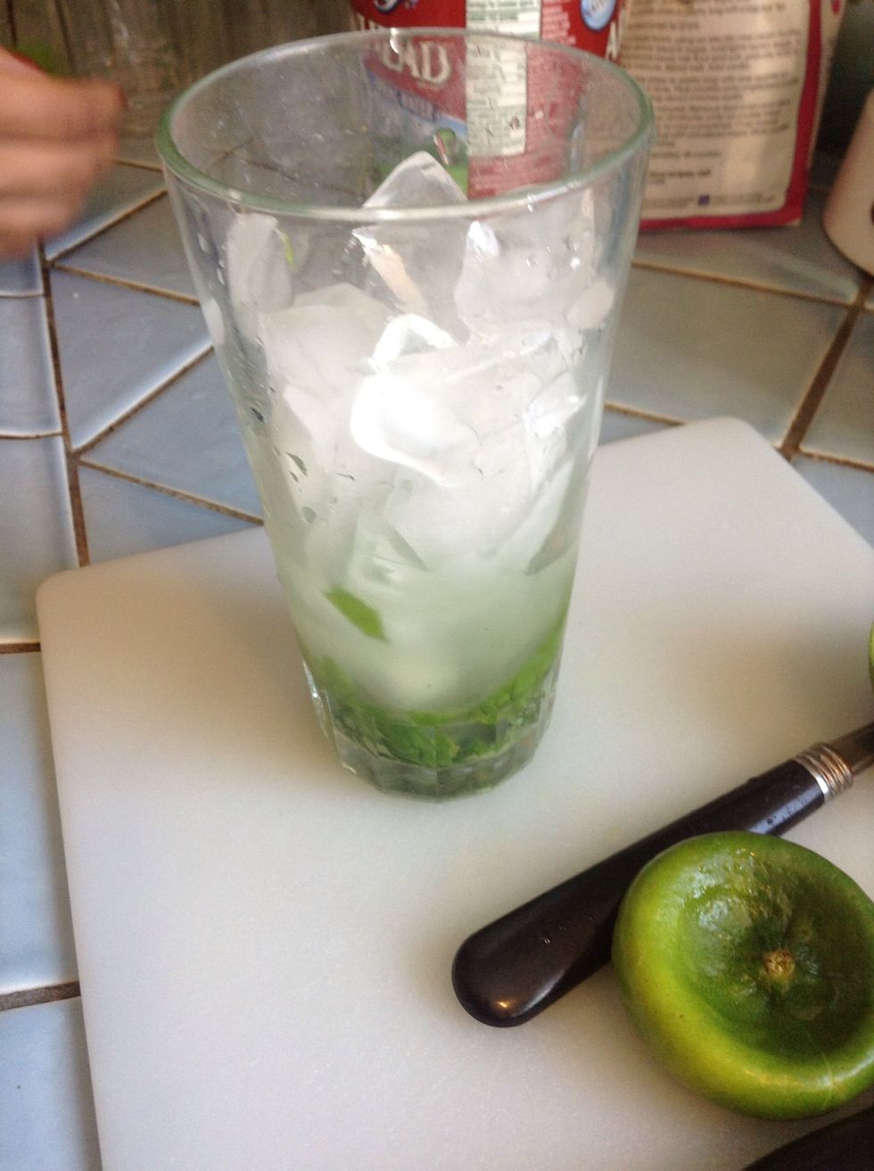 Put ice into the glass.