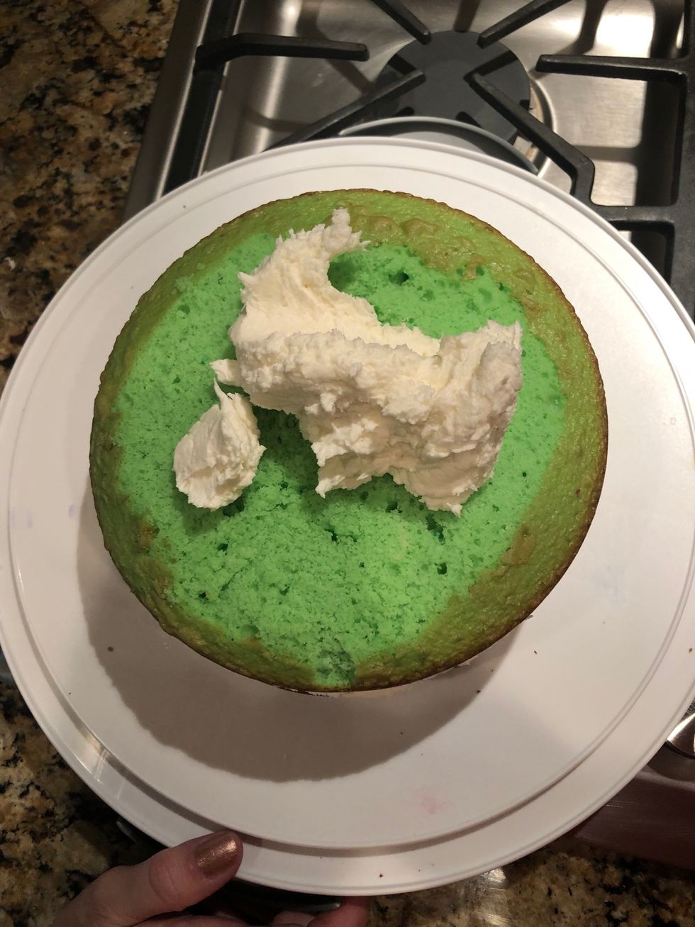 Put icing on the green layer until fully covered.