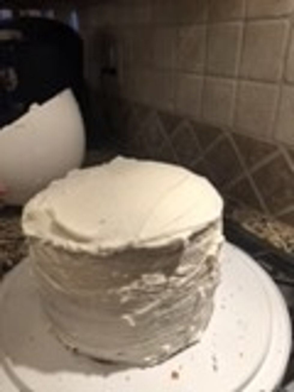 Put icing on top of the red layer until fully covered.
