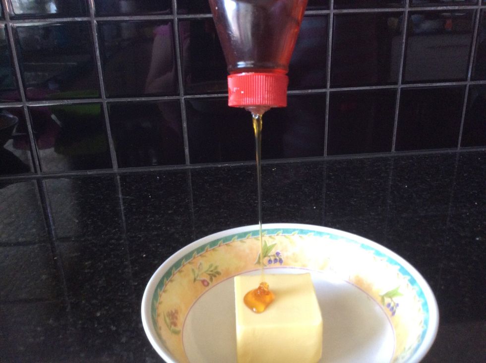 Put in 125g of butter and 1/4 of a cup of golden syrup in a different bowl