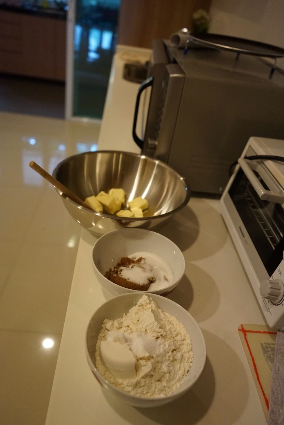 Put in 3 bowls 1) butter a bit soften but still cold 2) brown and caster sugar 3) flour salt baking powder and baking soda (bi-carb)