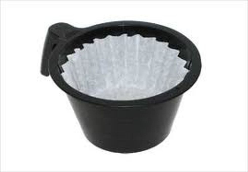 Put in a coffee filter in the filter of the coffee machine.