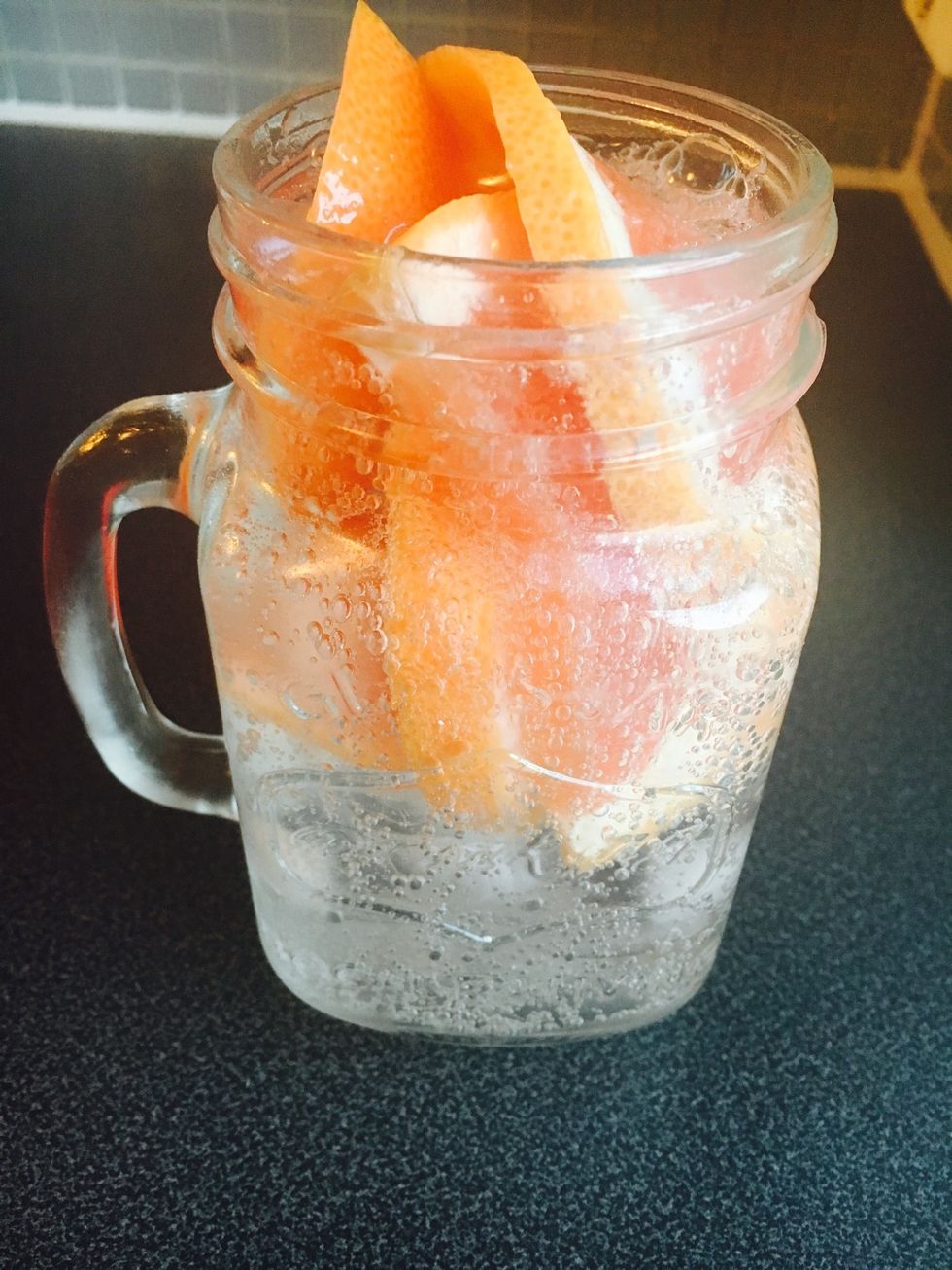 Put in a glass/glass jar with ice and semi-sparkling water