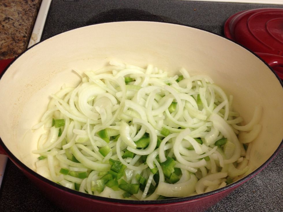 Put in bell peppers and sliced onion.