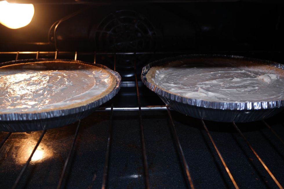 Put in both cookie plates into oven. Leave in for 30-40min. Check by putting a fork into the cake, if it comes out clean it's ready. Wait 15min until it cools before putting in the fridge overnight.