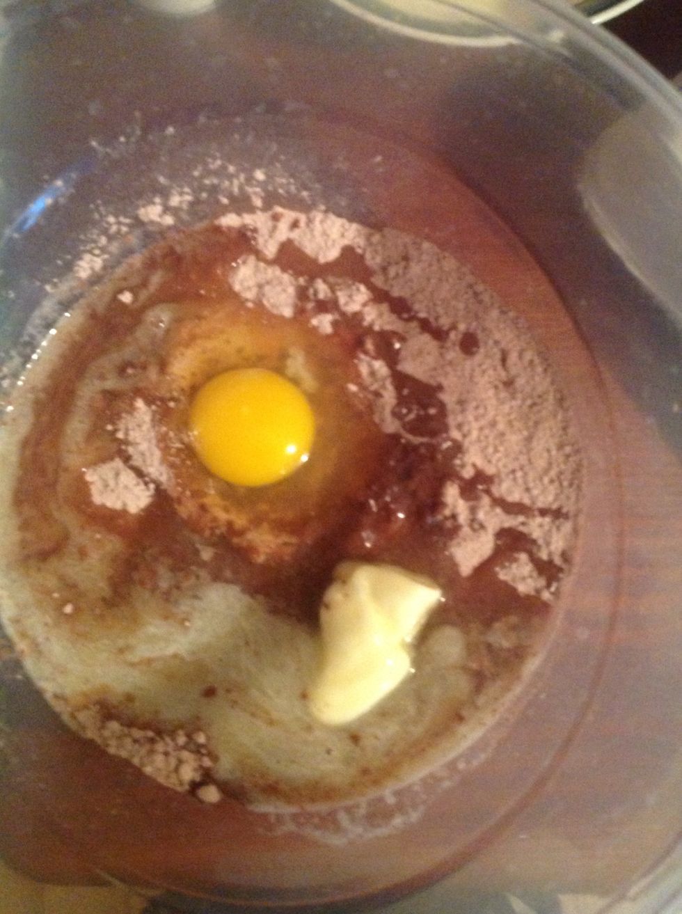 Put in mix along with 2 tbs of water an egg and 1/4 cup of melted butter