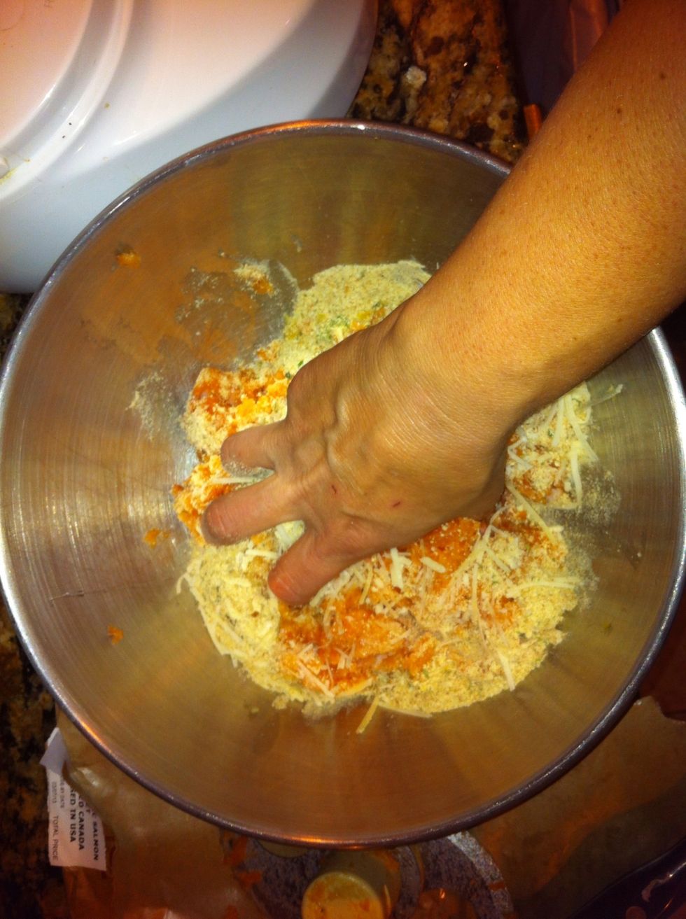 Put in mixing bowl with herb mixture. Add egg white, cheese, lemon juice, bread crumbs, salt, pepper. Use clean hands to mix well.