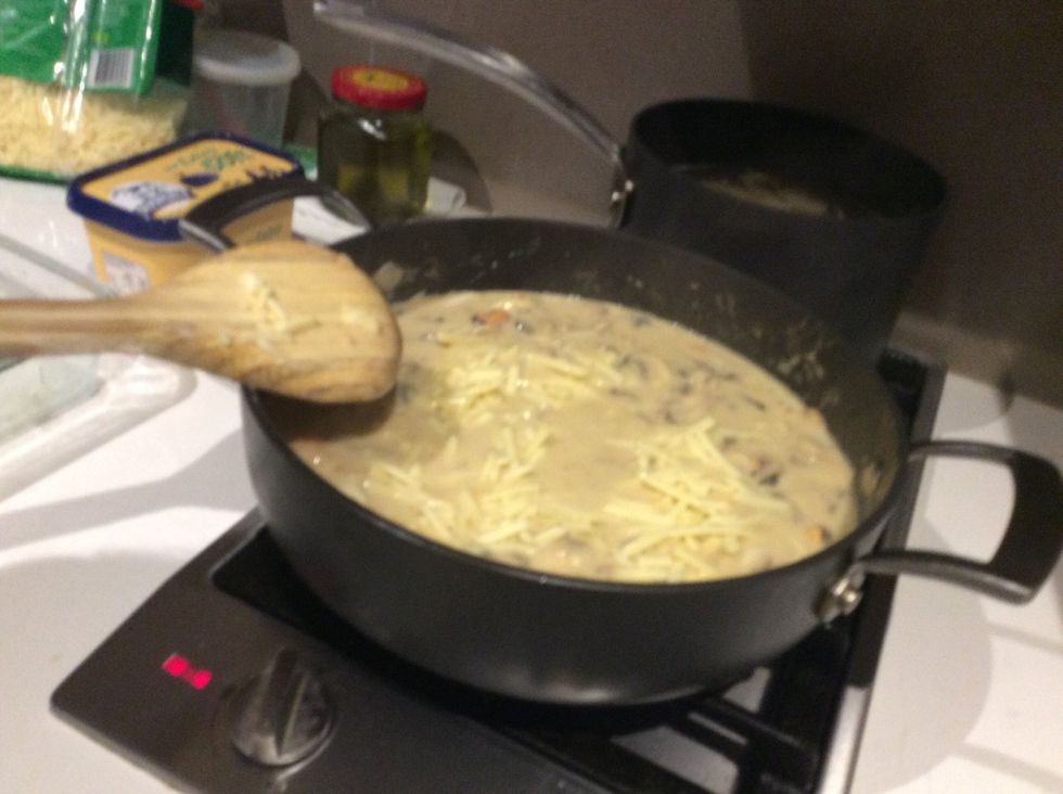 Put in only a handful of shredded cheddar and mix for 30 seconds.