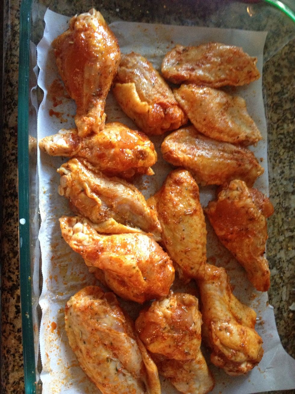 Put in oven and bake for 45minutes, after the first 20 minutes, flip wings over.
