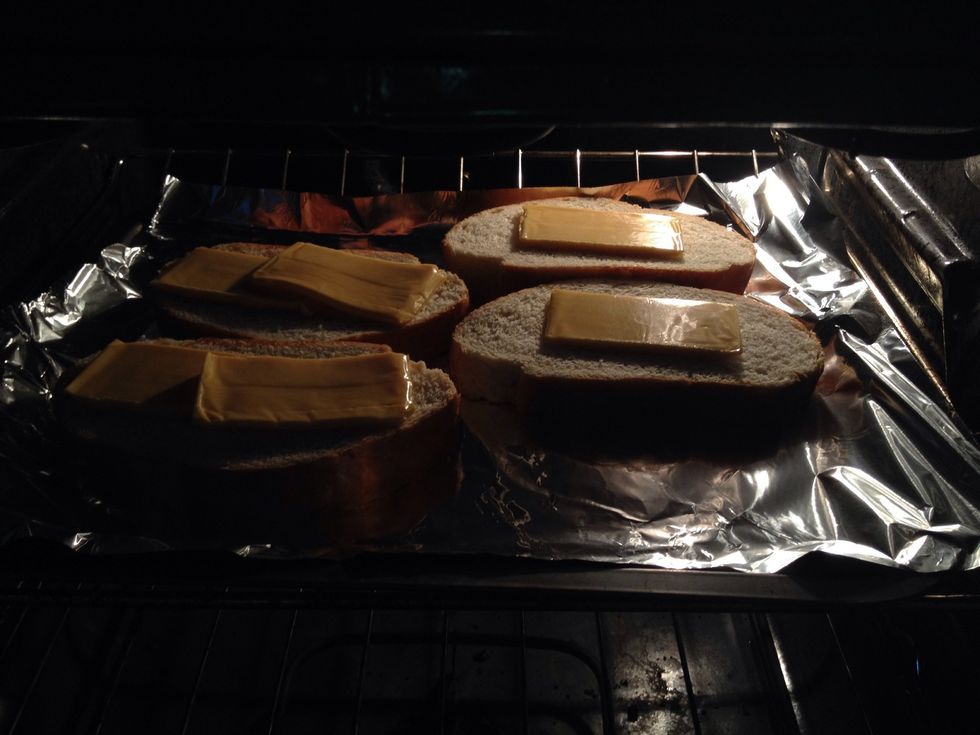 Put in oven and remove when cheese is melting and theirs a light browning on the rim of the bread.