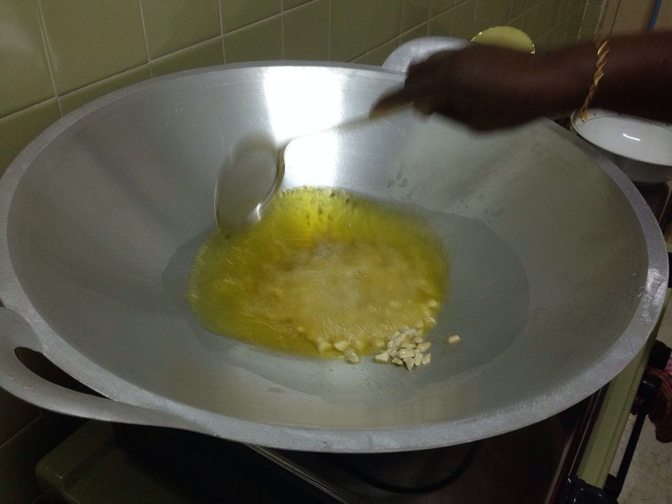 Put in the cashew nuts.