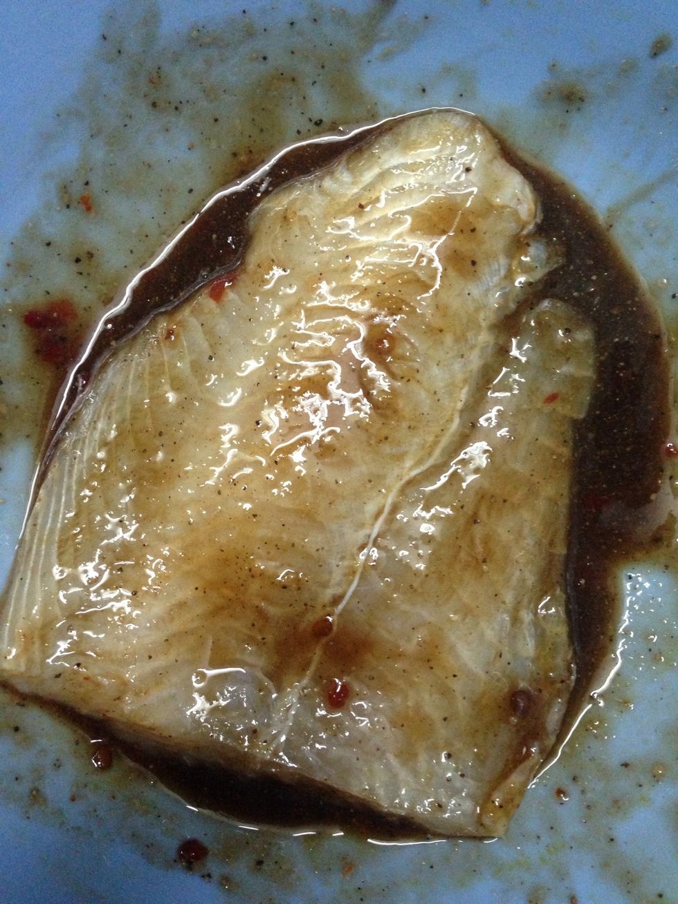 Put in the fish fillets and let it stand for about an hour