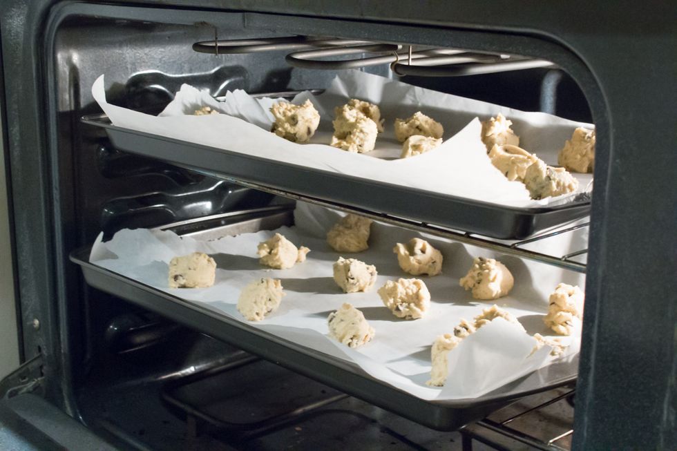 Put in the oven and bake for 15 minutes, or until the outer edges are a golden brown or slightly underbaked. Turn off the oven, and allow the cookies to cool on the rack for 5 minutes.
