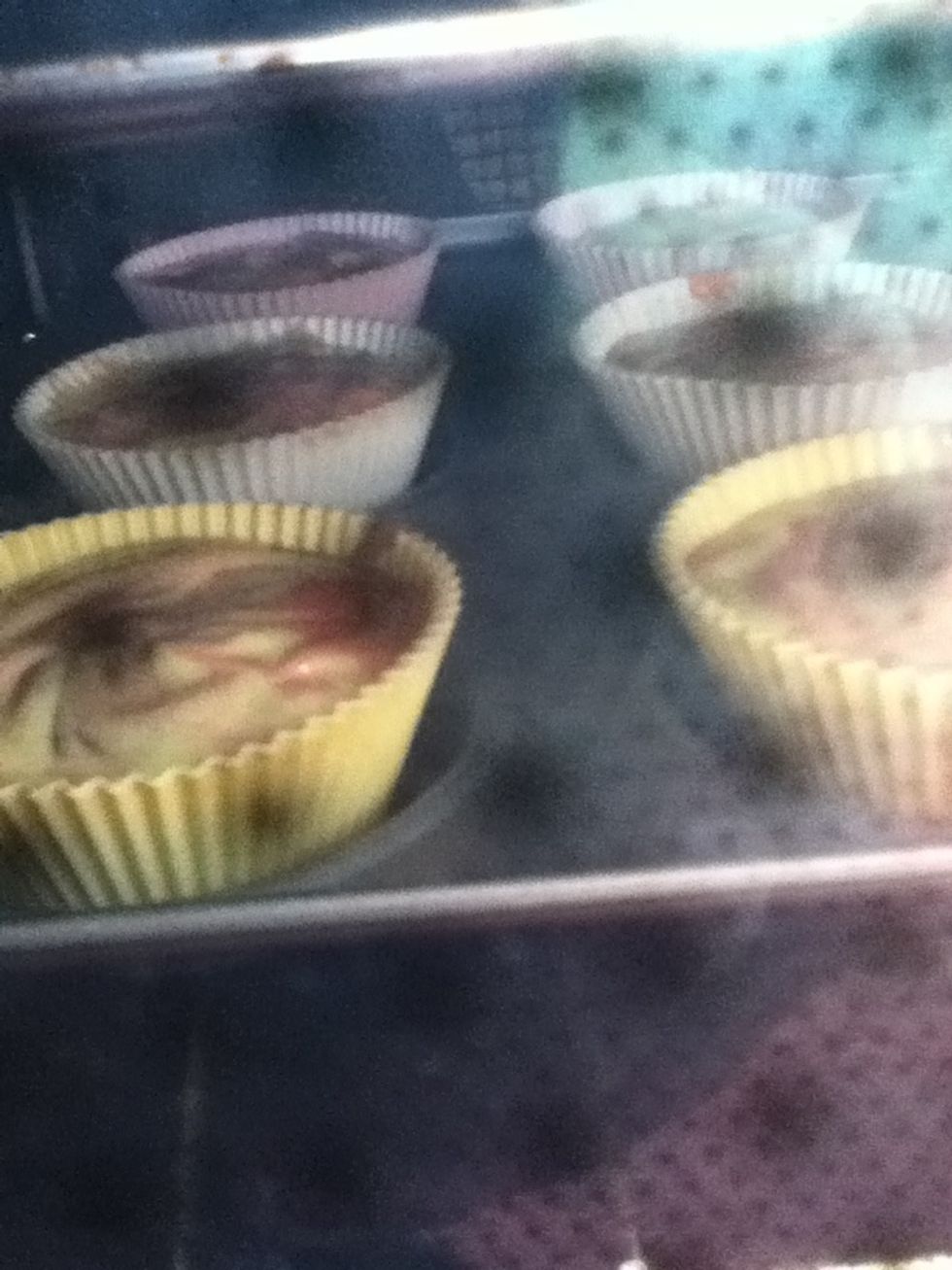 Put in the oven and cook for 20-30 minutes until they are golden brown. If you think they might be ready, check by putting a knife into a cake and if it comes out clean, its ready.
