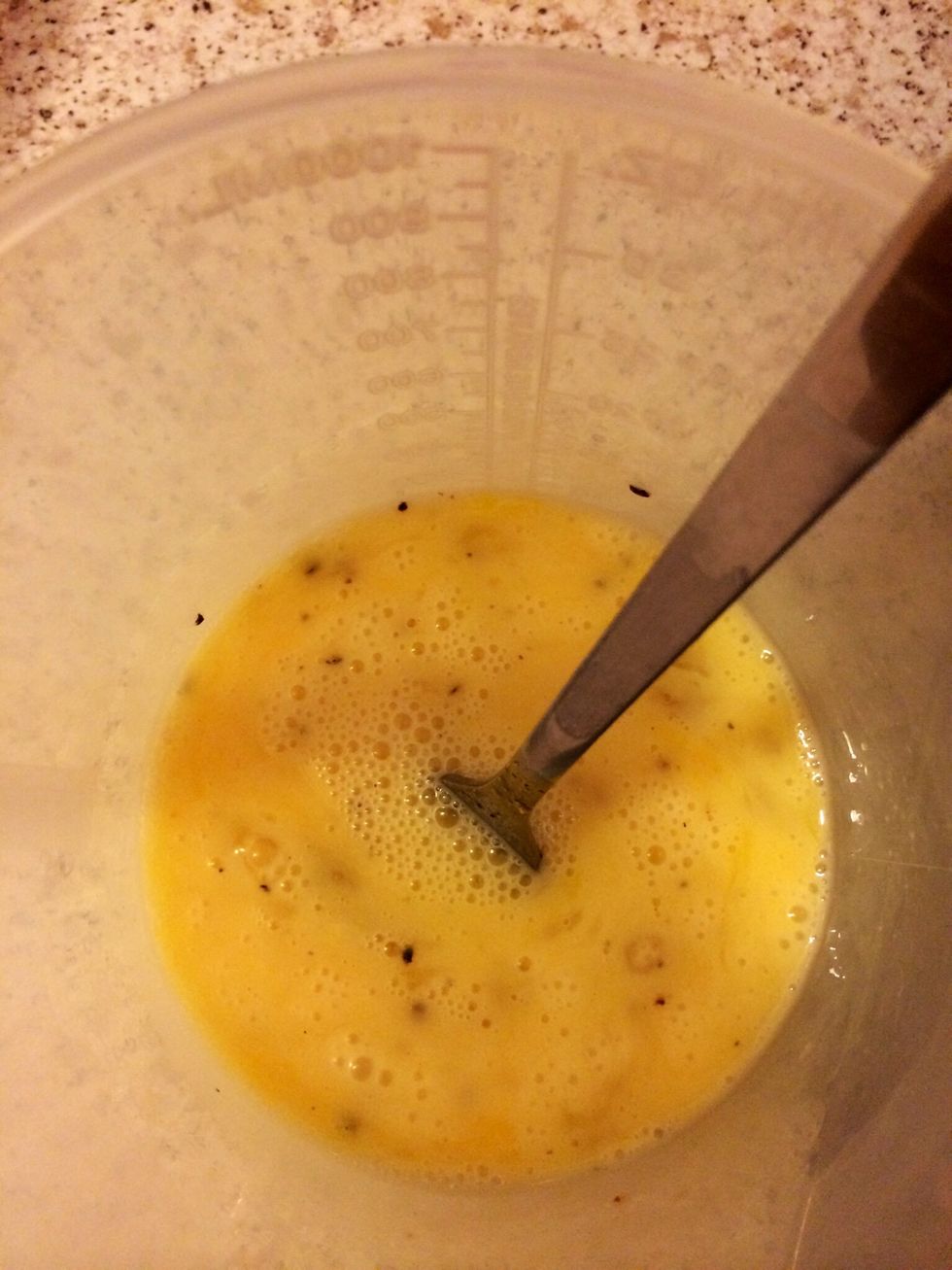 Put in three whole eggs and two egg whites in a bowl and beat together. Season with salt and pepper.