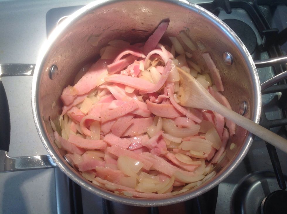 Put in your all your bacon onions and garlic and cook them until they change colour.