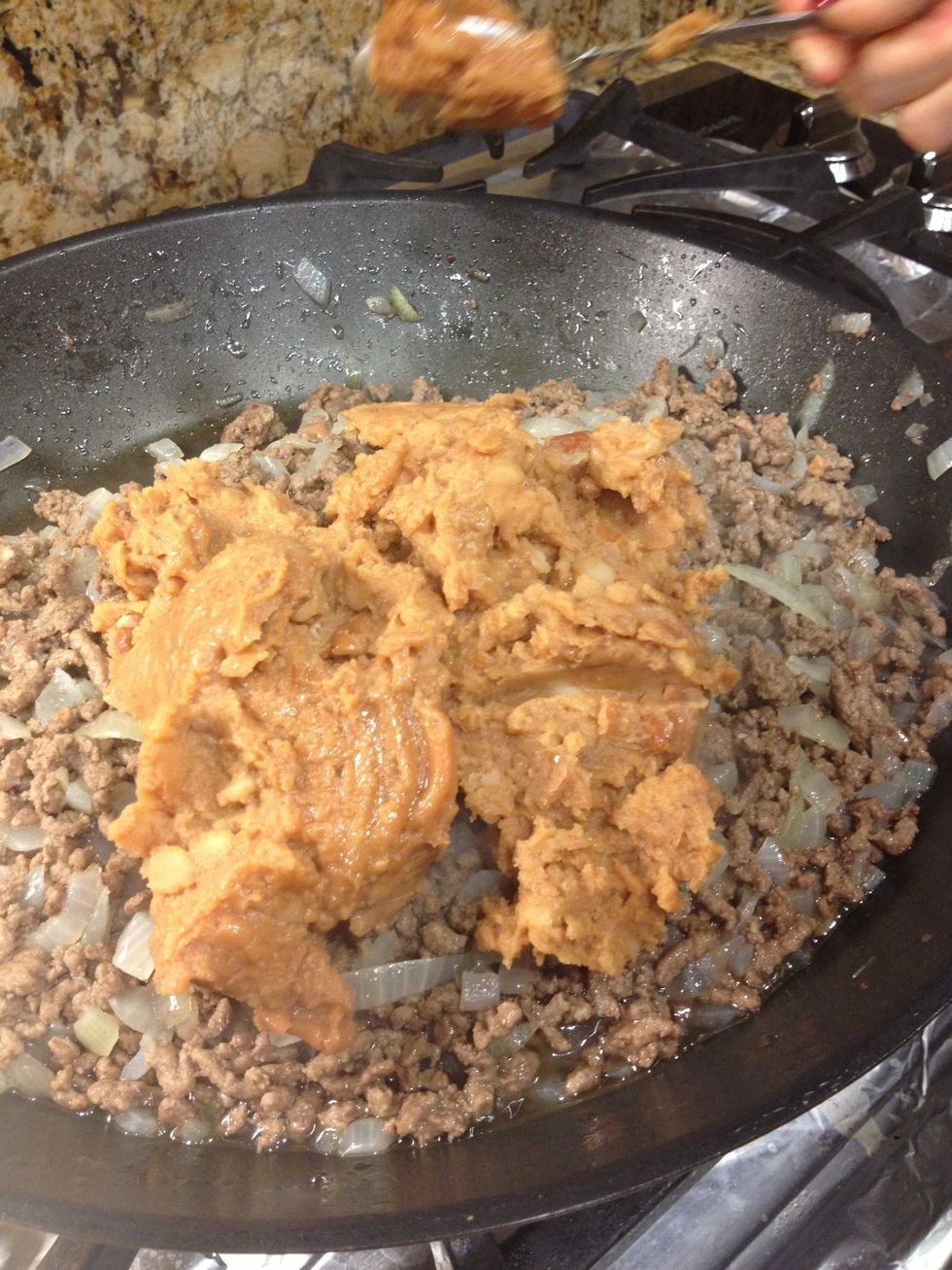 Put in your refried bean mixture (looks disgusting but tastes great)