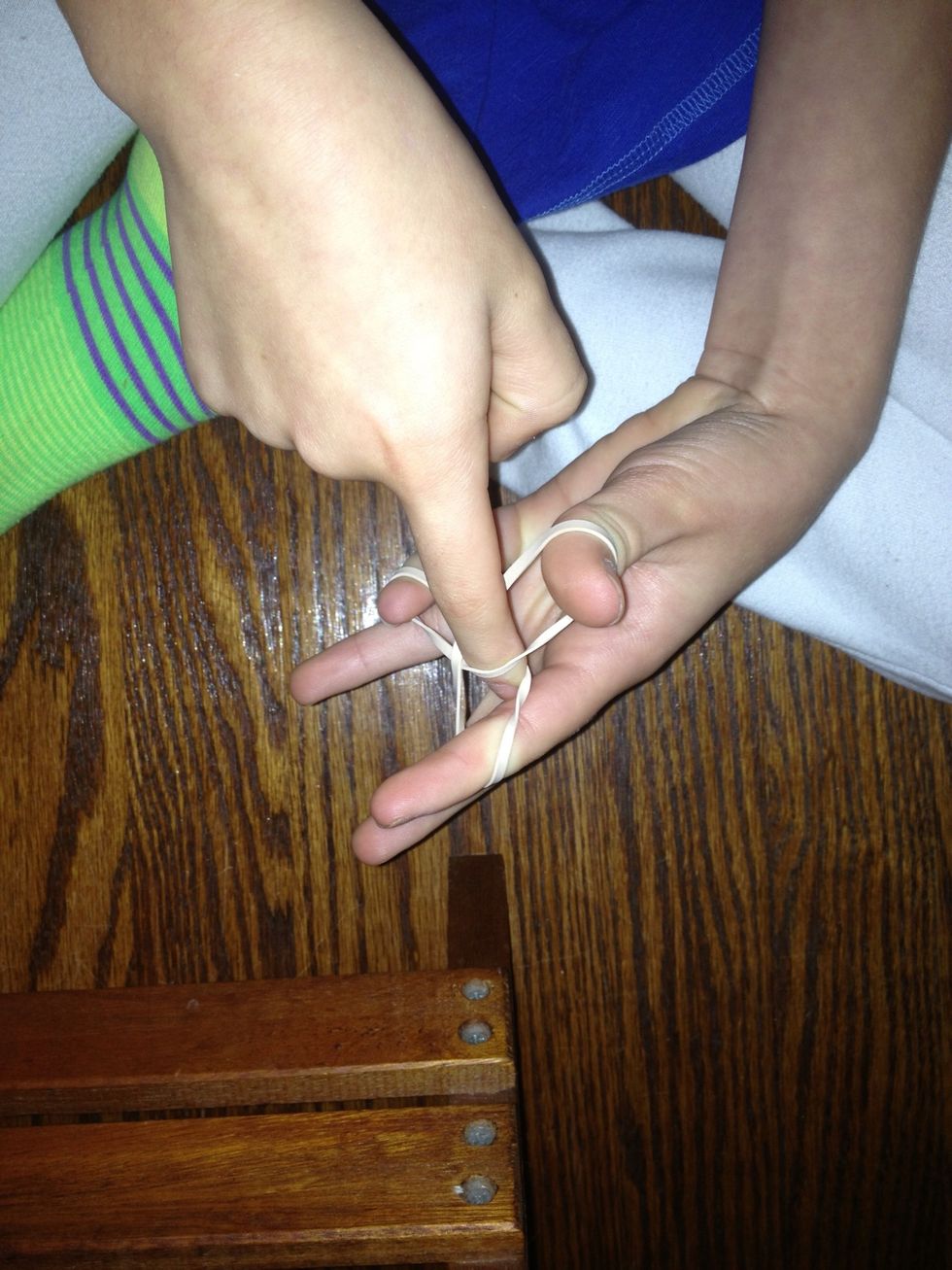 Put index finger in the other index finger hole