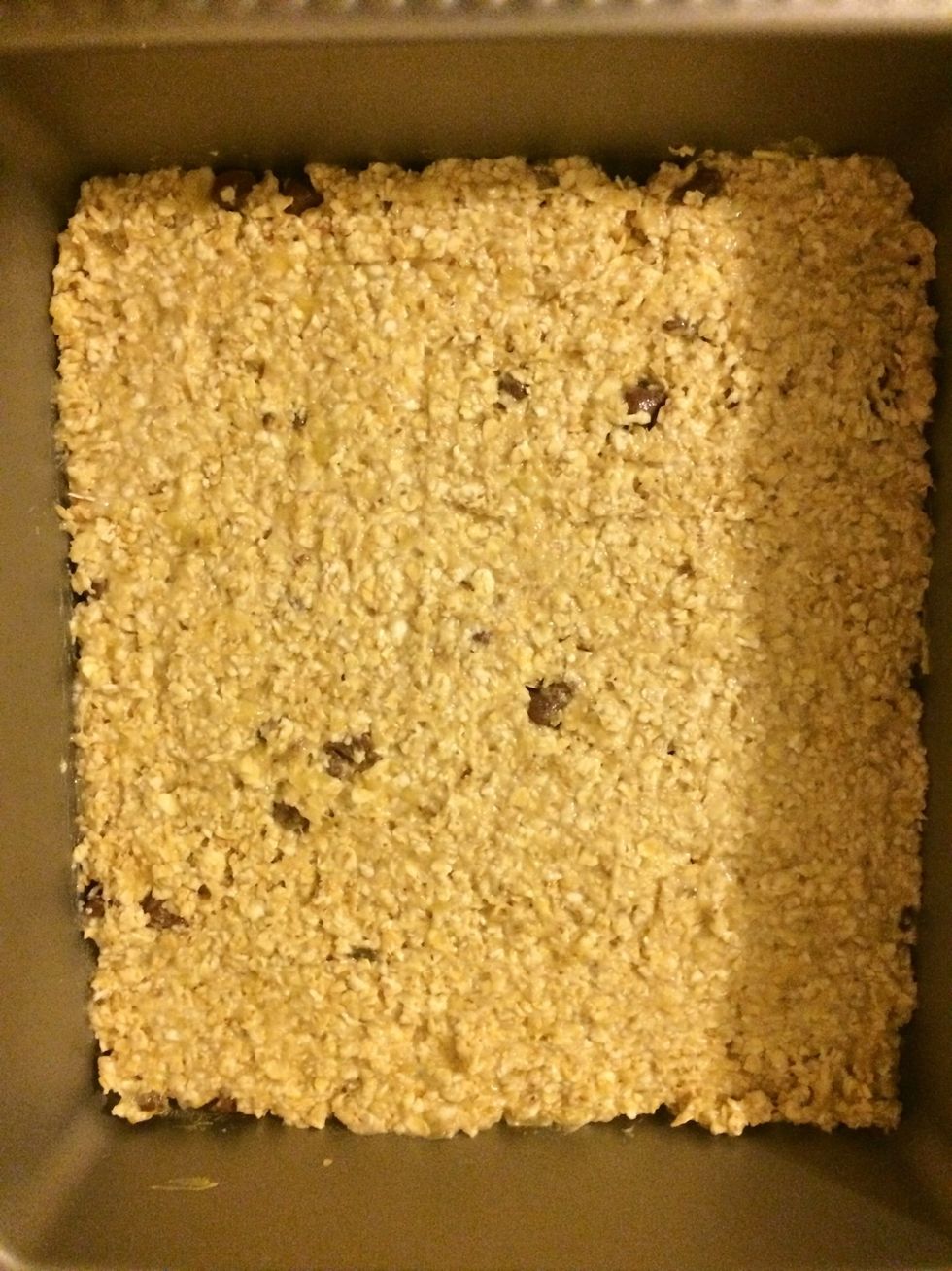 Put into a baking tray/tin and pat down. Bake in the oven at 180 degrees celsius for about 15-20mins or until golden brown.