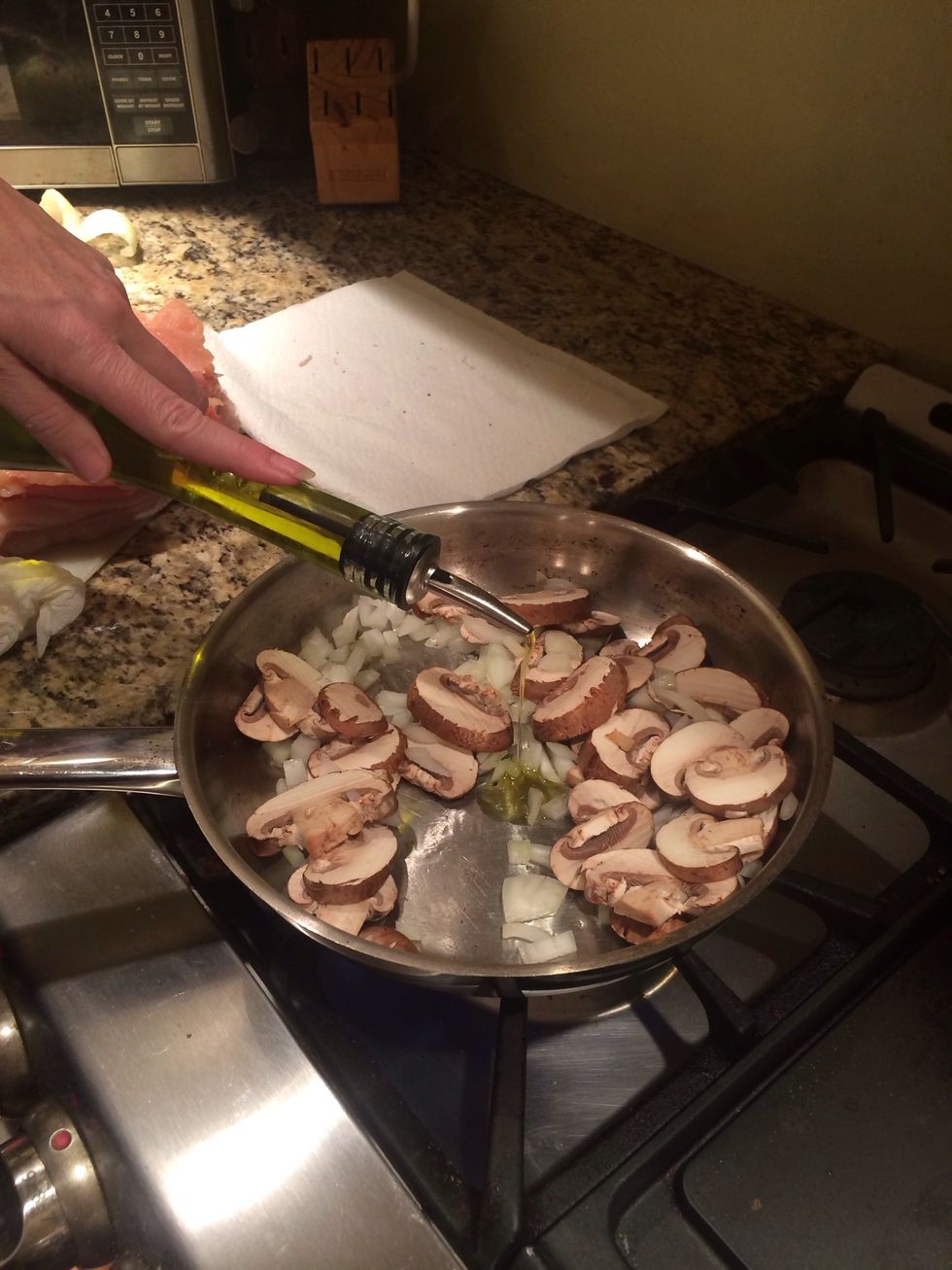 Put into a pan and saut\u00e9 the onions and mushrooms. Add some olive oil