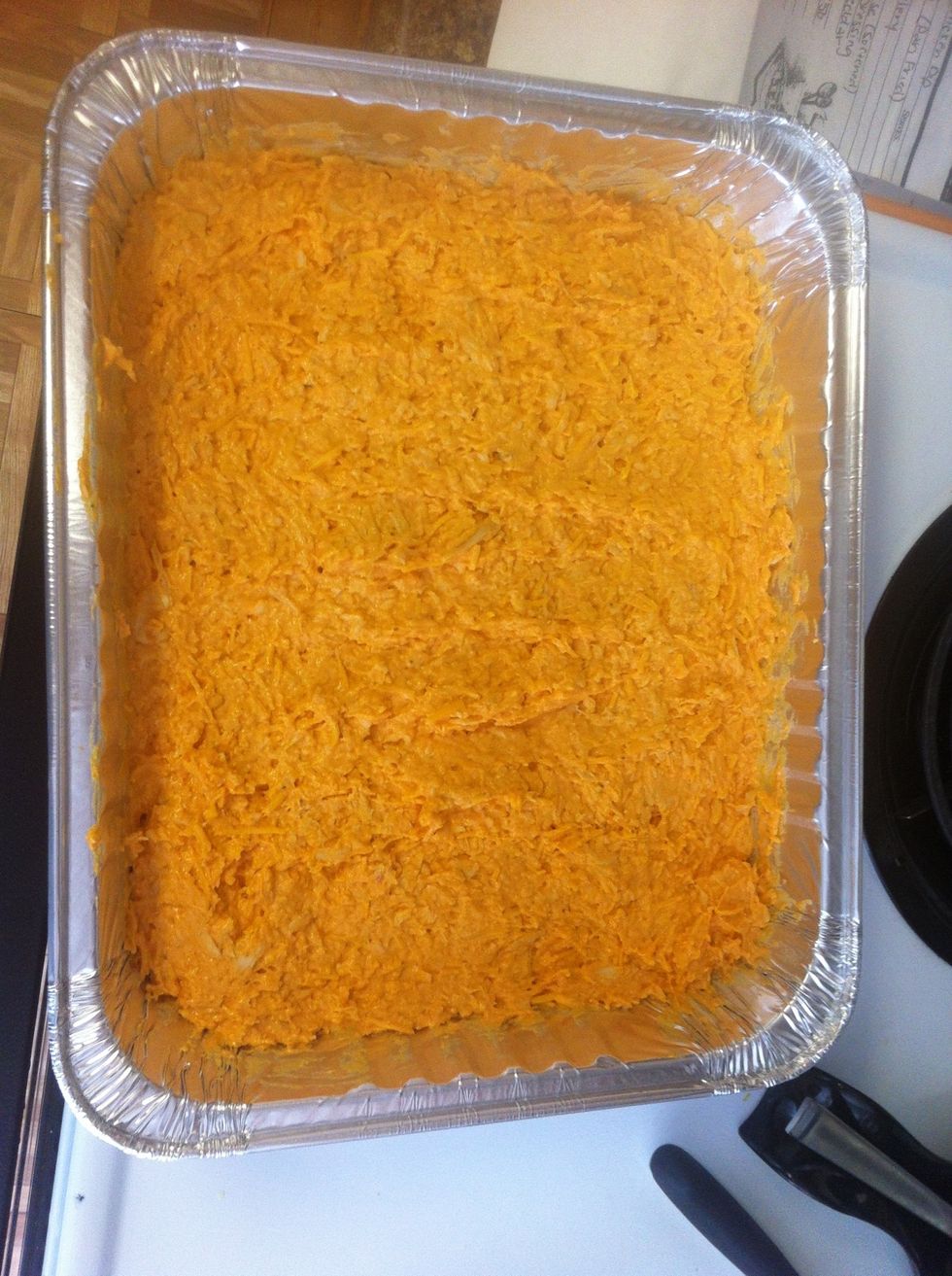 Put into an oven safe container. I usually use a large pyrex but this time I used a disposable container. Cover with aluminum foil and put in the oven for 45 minutes.